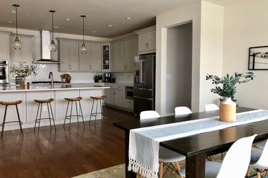 Inspiration for a large transitional dark wood floor and brown floor kitchen/dining room combo remodel in Other with white walls and no fireplace