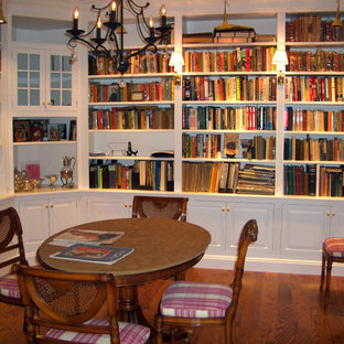 Enclosed dining room - transitional medium tone wood floor enclosed dining room idea in New York with red walls and no fireplace