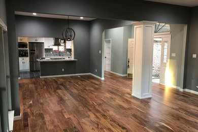 Inspiration for a large dining room in Dallas with grey walls and medium hardwood flooring.