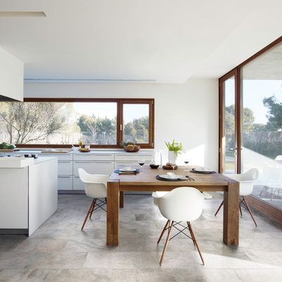Example of a trendy kitchen/dining room combo design in Sydney