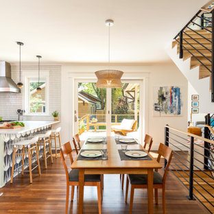 Great room - contemporary dark wood floor and brown floor great room idea in Denver with beige walls