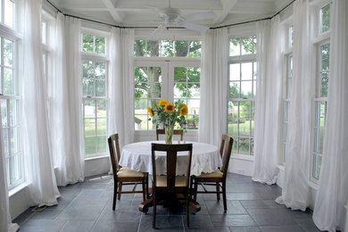 Photo of a traditional dining room in Other with white walls.