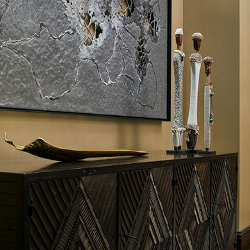 Contemporary and African Artwork on Carved Dining Room Chest