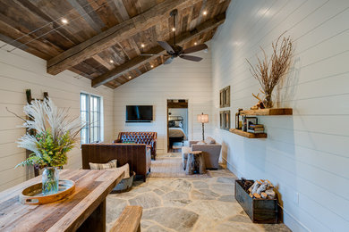 Great room - small rustic great room idea in Other with white walls and no fireplace