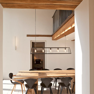 Ispirazione per una sala da pranzo minimal con pareti bianche e nessun camino