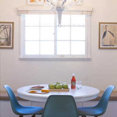 Dining room - contemporary medium tone wood floor dining room idea in Los Angeles with white walls