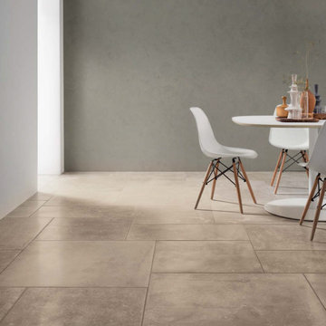 Contemporary dining area with beige stone look porcelain tile