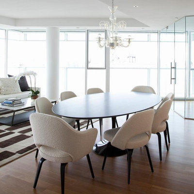 Inspiration for a contemporary medium tone wood floor dining room remodel in New York