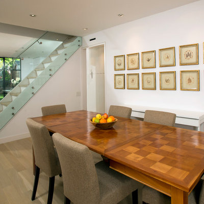 Example of a trendy dining room design in DC Metro with white walls