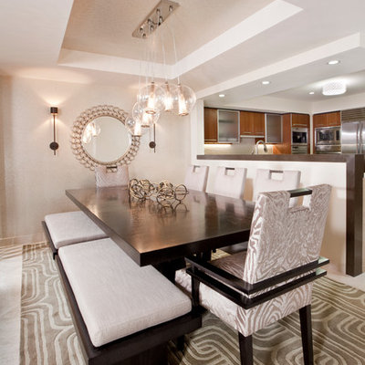 Inspiration for a contemporary kitchen/dining room combo remodel in Miami with beige walls