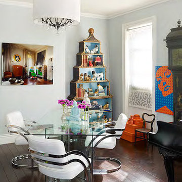 Contemporary dining room with a stack of hermes boxes and pop art!