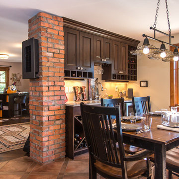 Contemporary farmhouse style dining room incorporates brick chimney from origina
