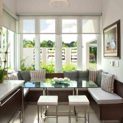 Example of a mid-sized trendy ceramic tile kitchen/dining room combo design in Other with white walls
