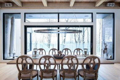 Example of a mountain style dining room design in Montreal