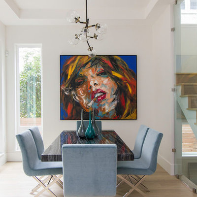 Inspiration for a mid-sized contemporary light wood floor and beige floor great room remodel in Vancouver with white walls and no fireplace