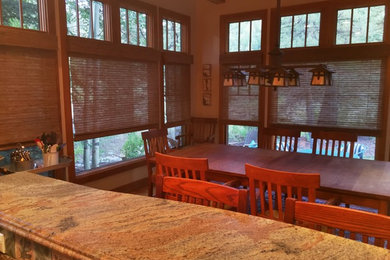 Example of a transitional dining room design in Denver