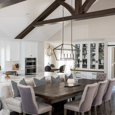 Large transitional dark wood floor and brown floor breakfast nook photo in Indianapolis with no fireplace and beige walls