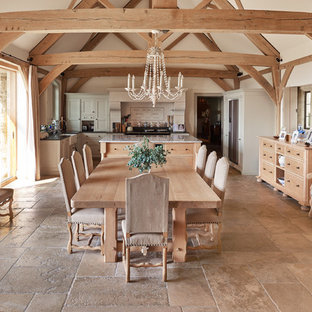 Inspiration for a farmhouse kitchen/dining room in Wiltshire with white walls, no fireplace, beige floors and limestone flooring.