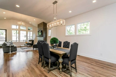 Mid-sized transitional light wood floor great room photo in Nashville with white walls and no fireplace