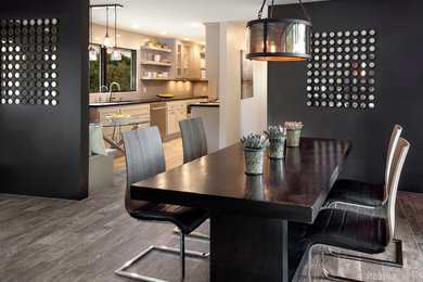 Large trendy medium tone wood floor kitchen/dining room combo photo in Santa Barbara with black walls