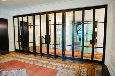 Enclosed dining room - mid-sized contemporary dark wood floor and brown floor enclosed dining room idea in Columbus with white walls