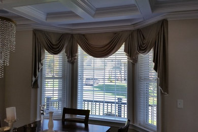 Example of a mid-sized classic enclosed dining room design in New York with beige walls