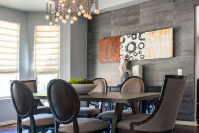 Large trendy dark wood floor and brown floor enclosed dining room photo in Phoenix with gray walls and no fireplace