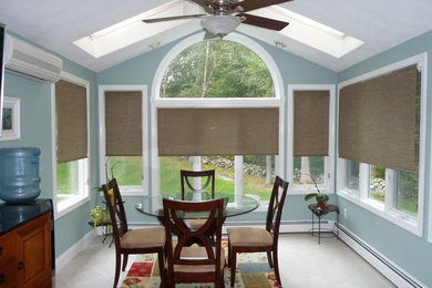Example of a mid-sized trendy ceramic tile enclosed dining room design in Providence with blue walls