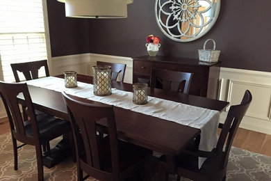 Example of a mid-sized trendy light wood floor enclosed dining room design in Columbus with gray walls and no fireplace