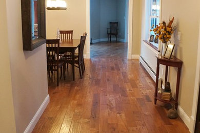 Inspiration for a mid-sized timeless medium tone wood floor kitchen/dining room combo remodel in Boston with gray walls