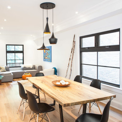Inspiration for a mid-sized contemporary light wood floor great room remodel in Toronto with white walls