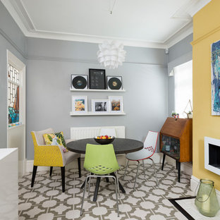Inspiration for a medium sized eclectic kitchen/dining room in Other with vinyl flooring, white floors, yellow walls and a ribbon fireplace.