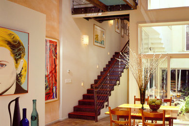 На фото: кухня-столовая среднего размера в современном стиле с бетонным полом и бежевыми стенами без камина с