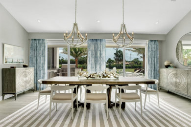 Inspiration for a large coastal porcelain tile, gray floor and vaulted ceiling great room remodel in Miami with gray walls