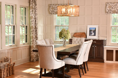 Inspiration for a mid-sized eclectic medium tone wood floor kitchen/dining room combo remodel in Other with white walls