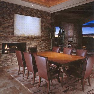 Ejemplo de comedor de estilo americano, grande, cerrado, con paredes beige, suelo de travertino, chimenea de doble cara y marco de chimenea de piedra