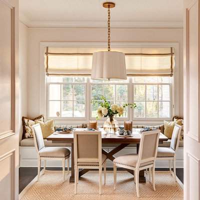 Elegant dark wood floor dining room photo in Charlotte with beige walls