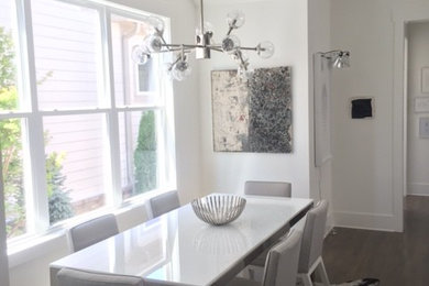 Mid-sized minimalist dark wood floor kitchen/dining room combo photo in Nashville with white walls
