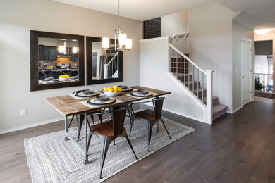 Inspiration for a contemporary dark wood floor dining room remodel in Calgary with gray walls