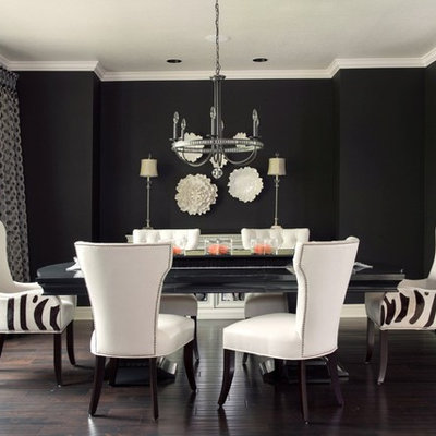 Inspiration for a transitional dark wood floor and brown floor dining room remodel in Kansas City with black walls
