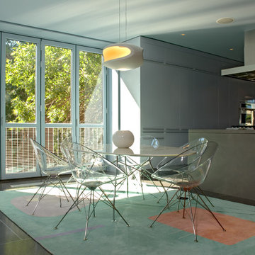 Dining area and kitchen with balcony.