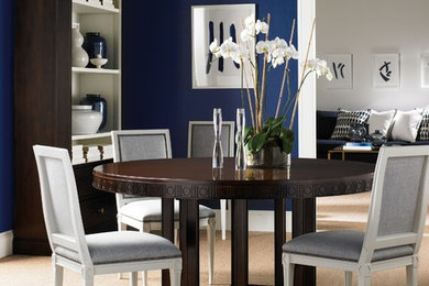 Example of a trendy dining room design in New York with blue walls