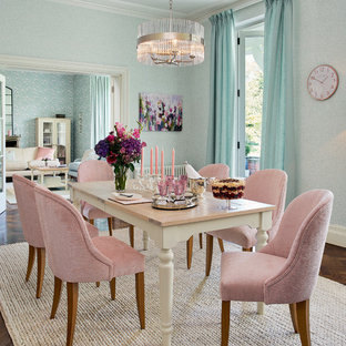 Classic enclosed dining room in London with blue walls and dark hardwood flooring.