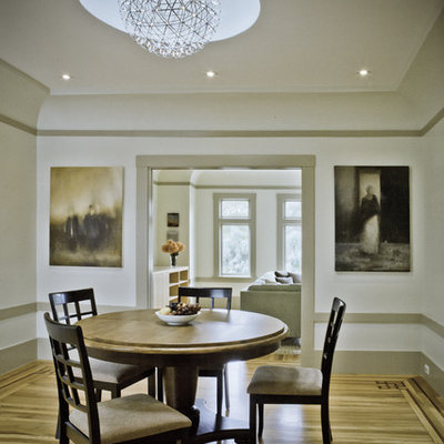 Inspiration for a timeless medium tone wood floor dining room remodel in San Francisco with white walls