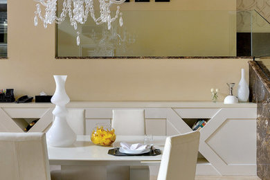 Inspiration for a contemporary dining room remodel in Other with beige walls