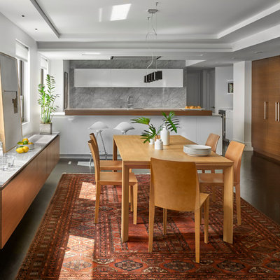 Mid-sized trendy dark wood floor kitchen/dining room combo photo in Chicago with white walls