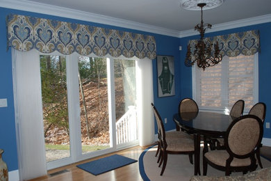 Inspiration for a medium sized classic kitchen/dining room in Boston with blue walls, medium hardwood flooring, no fireplace and brown floors.
