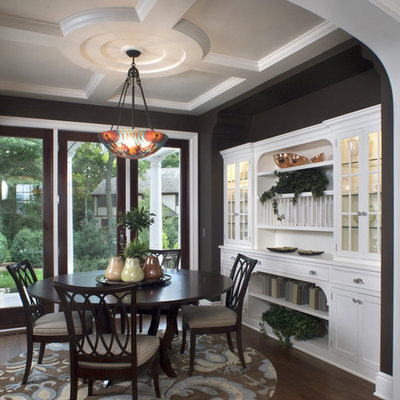 Inspiration for a timeless brown floor dining room remodel in Minneapolis with black walls