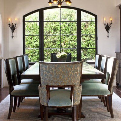 Inspiration for a mid-sized mediterranean ceramic tile and brown floor dining room remodel in Los Angeles with white walls and no fireplace