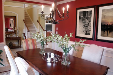 Inspiration for a mid-sized transitional ceramic tile enclosed dining room remodel in Dallas with red walls